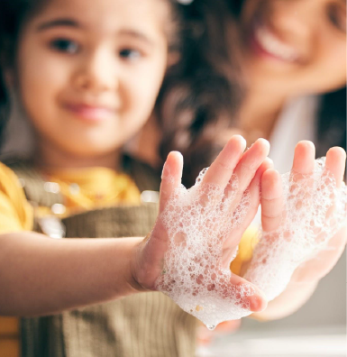 kid washing with soap